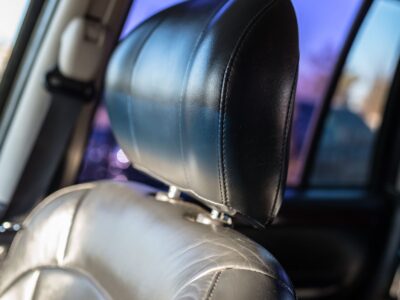 Was ist die Hauptfunktion der Kopfstütze im PKW